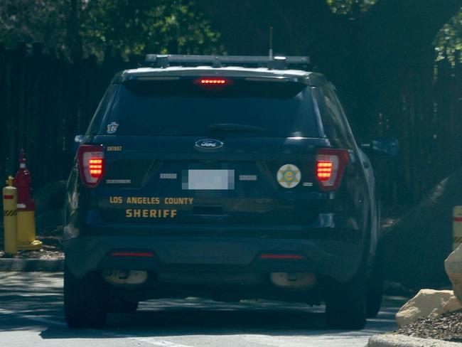 Officers from LA County Sheriff were spotted driving into the gates of the Calabasas mansion in a marked patrol car. Picture: Splash News/Media Mode