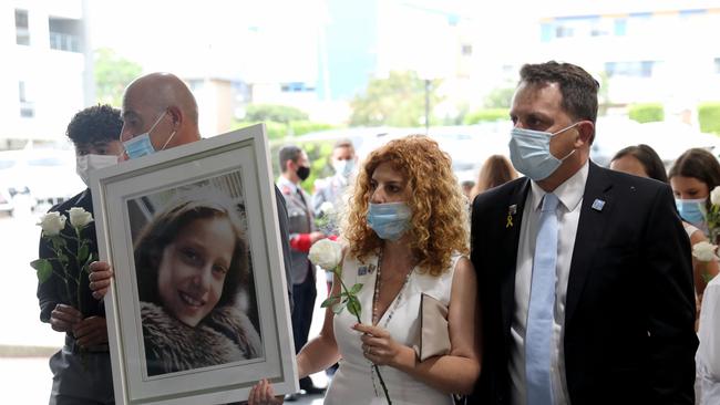 Bridget Sakr pictured holding a portrait of her daughter 11-year-old daughter Veronique. Picture by Damian Shaw