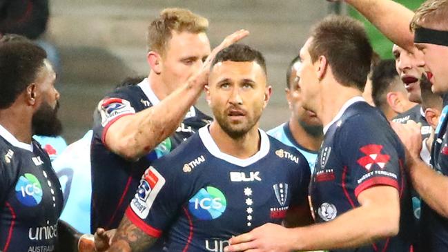 MELBOURNE, AUSTRALIA - MAY 31: Quade Cooper of the Rebels is congratulated by his teammates after scoring a try during the round 16 Super Rugby match between the Rebels and the Waratahs at AAMI Park on May 31, 2019 in Melbourne, Australia. (Photo by Scott Barbour/Getty Images)