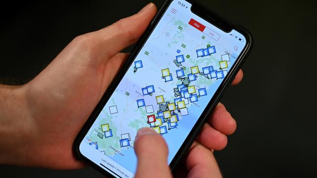 A smartphone displaying the NSW Government Fires Near Me application which helped thousands stay up to date with the catastrophic bushfire danger on Tuesday. Picture: AAP