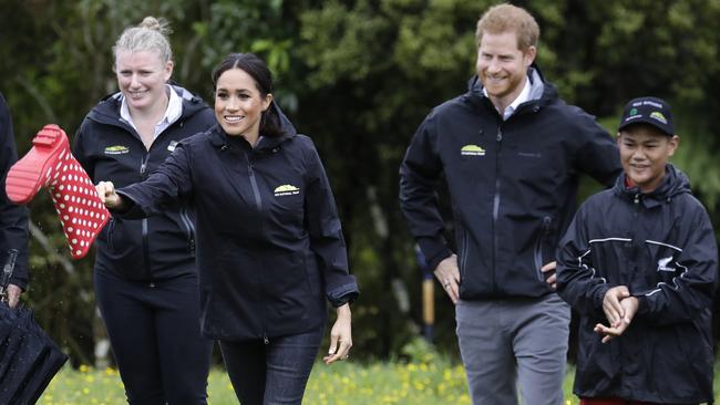 Meghan, Duchess of Sussex tries a spot of well wanging after the royal couple dedicated a 20-hectare area of native bush to the Queen's Commonwealth Canopy in Auckland. Picture: Kirsty Wigglesworth/AP