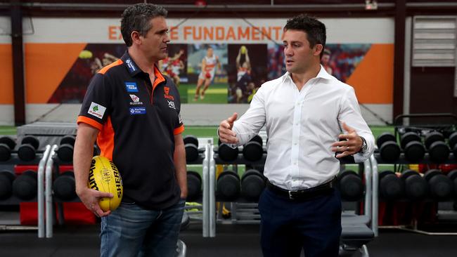 Former NRL premiership star Cooper Cronk passes on leadership tips to GWS coach Leon Cameron. Picture: Toby Zerna