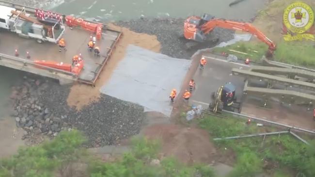 Construction of a temporary bridge is underway at Ollera Creek, midway between Townsville and Ingham. Picture: TMR