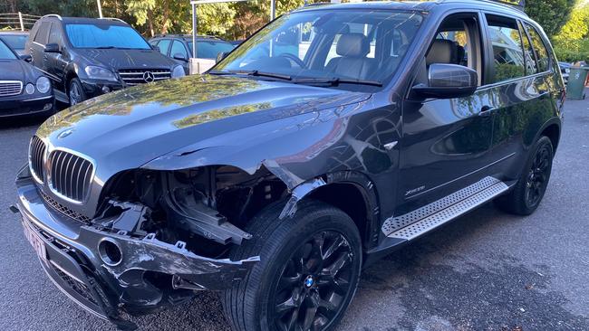 A smashed BMW at the Darra dealership.