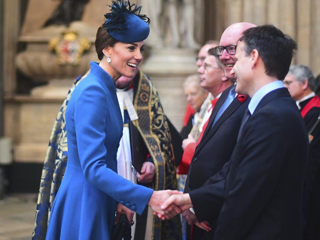 Kate shakes hands with unidentified guests during the Anzac Day Service of Commemoration and Thanksgiving at Westminster Abbey, in London. Picture: AP