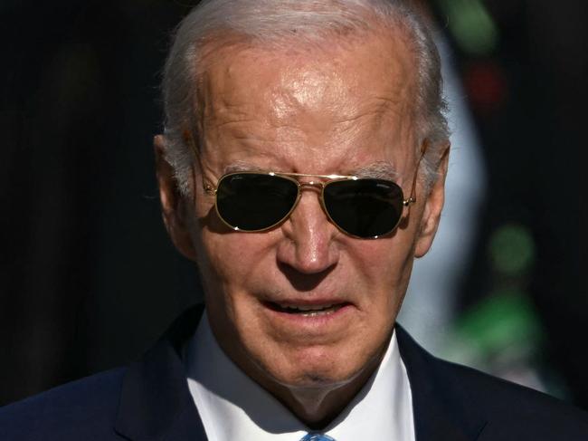 TOPSHOT - US President Joe Biden is pictured after the group photo at the end of the first session of the G20 Leaders' Meeting in Rio de Janeiro, Brazil, on November 18, 2024. (Photo by Mauro PIMENTEL / AFP)