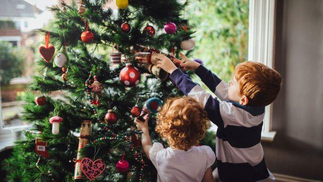 Deocrating the Christmas tree is a family affair. Image: iStock