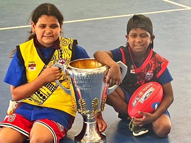 Sadadeen Primary School students with the AFL premiership cup in Alice Springs, September, 2024.