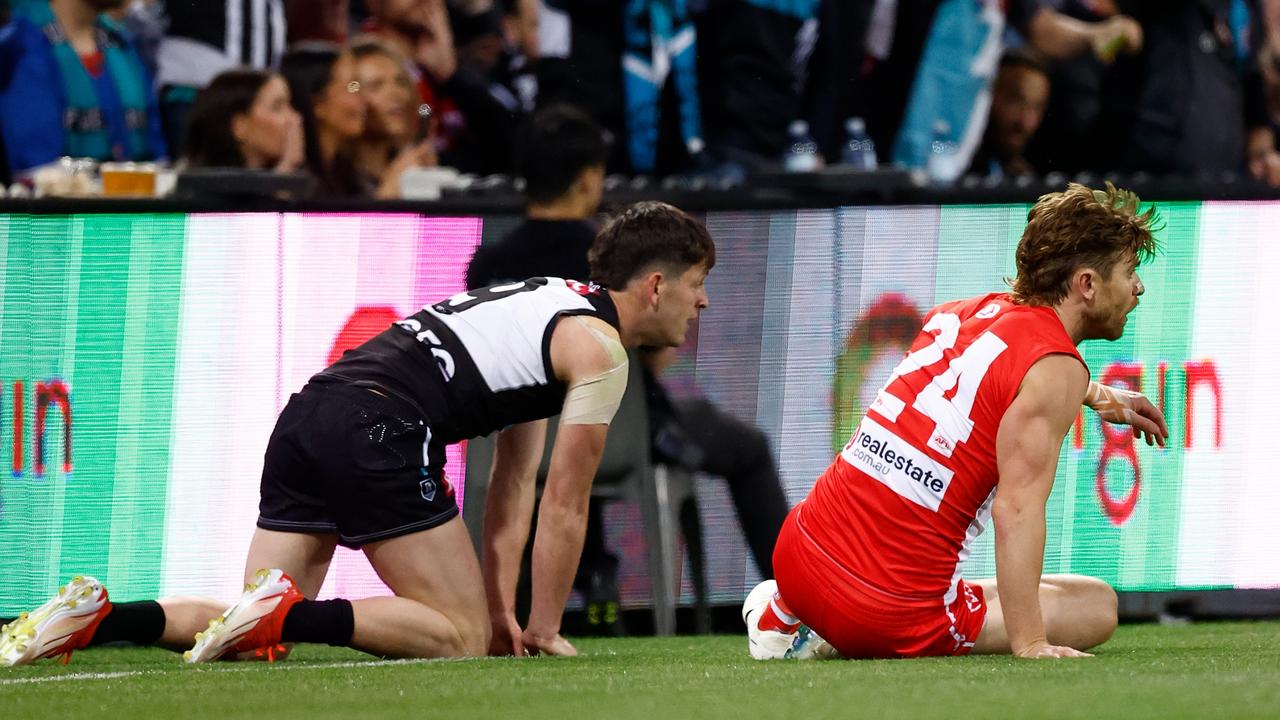 Dane Rampe of the Swans and Zak Butters of the Power. Picture: Michael Willson/AFL Photos via Getty Images