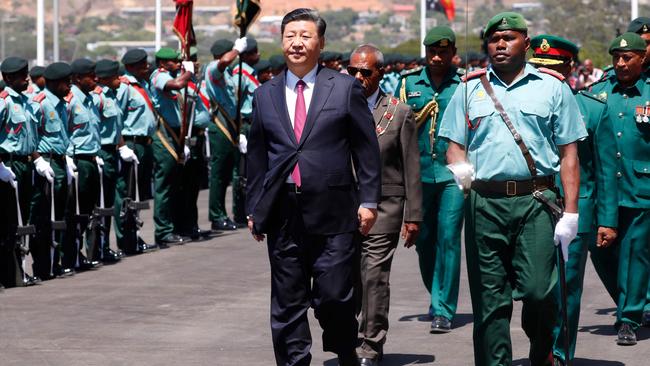 Mr Xi receives a military honour guard yesterday. Picture: AFP