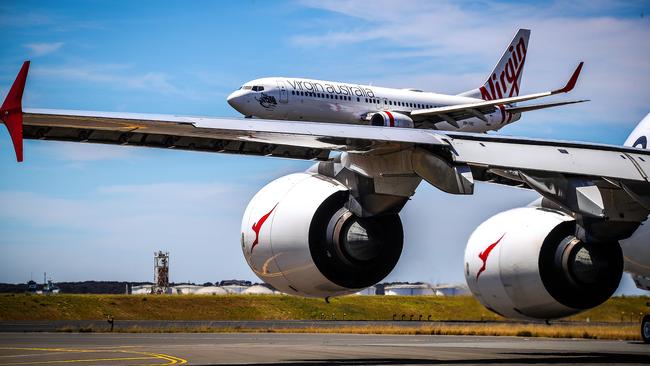 Qantas and Virgin Australia planes at Kingsford Smith International airport on November 15, 2019 in Sydney, Australia.