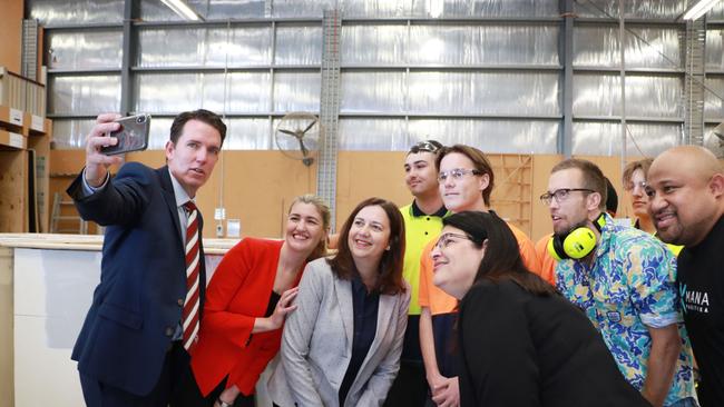 Marsden State High School principal Andrew Peach takes a photo of the Premier and Education Minister Grace Grace and students at the school this morning.