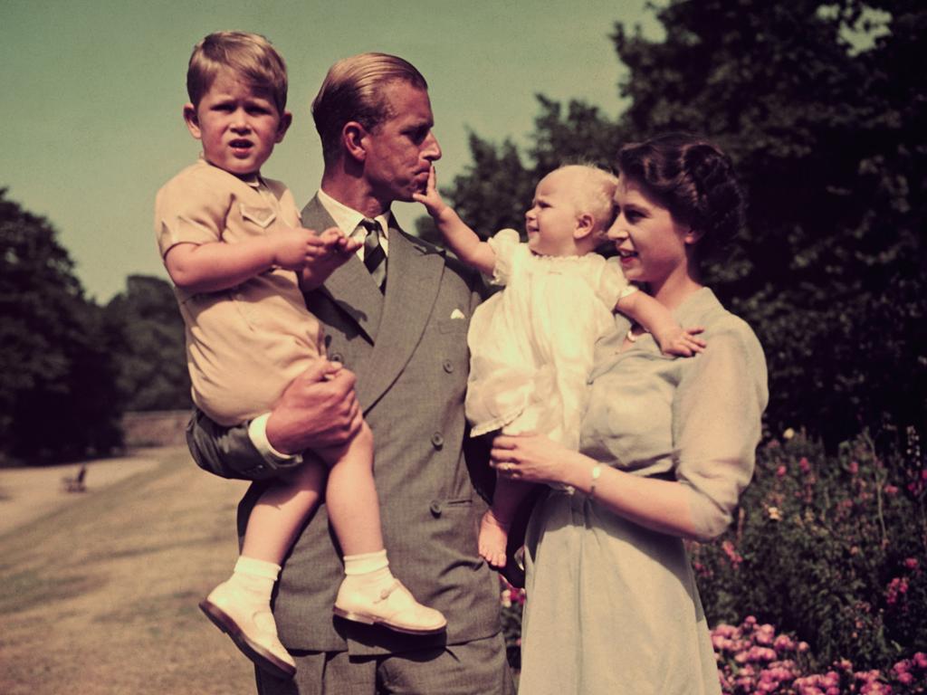 1951: Prince Philip and Princess Elizabeth pose for a photo with a playful Princess Anne and Prince Charles. Picture: Keystone/Hulton Archive/Getty Images