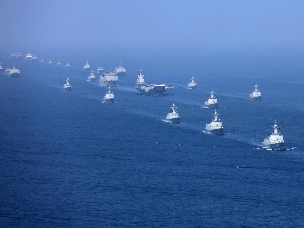 In this April 12, 2018 photo released by Xinhua News Agency, the Liaoning aircraft carrier is accompanied by navy frigates and submarines conducting an exercises in the South China Sea. Picture: Li Gang/Xinhua