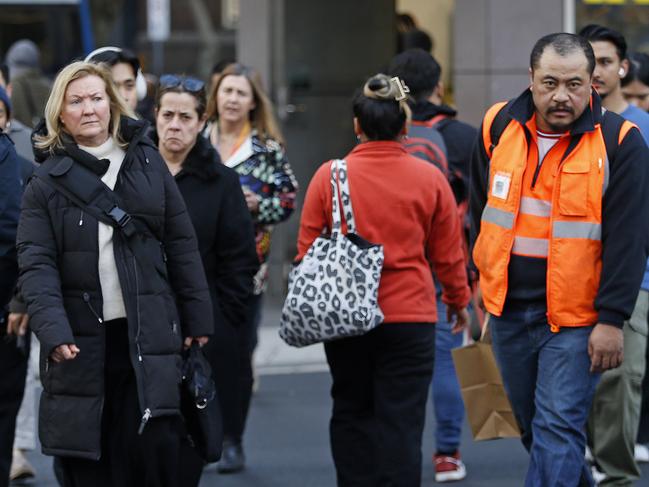 SYDNEY, AUSTRALIA - NewsWire Photos JULY 17, 2024:  Pedestrians crossing Elizabeth street   in the Sydney CBD. The Australian Bureau of Statistics, (ABS) releases it's latest job figures tomorrow.  Picture: NewsWire / John Appleyard