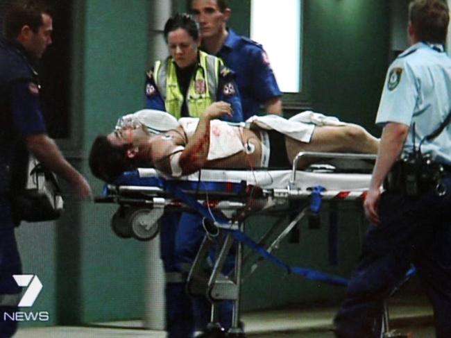 Fadi Ibrahim being wheeled into hospital after he was shot five times outside his home. Picture: Seven News