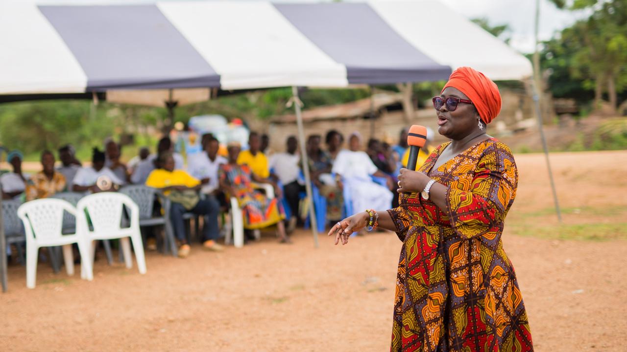 Yaa Peprah-Amekudzi, the lead manager of Cadbury parent Mondelez’s Cocoa Life program in Ghana, talks to villagers from a cocoa growing community. Picture: Kwabena Agyeman / KwaMani Photography.