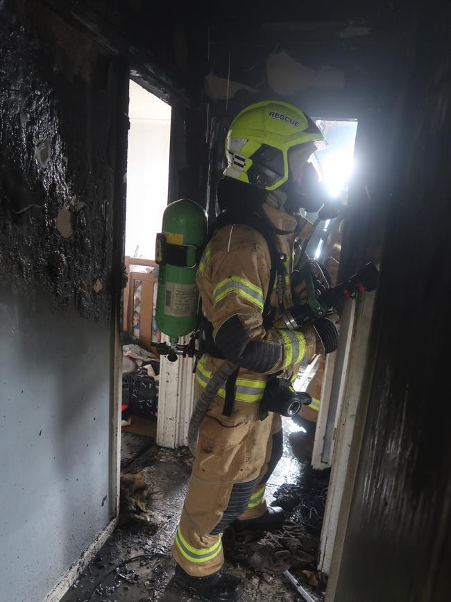 Firefighters ventured into the fire ravaged home to save the family’s pets. Picture: Fire and Rescue NSW