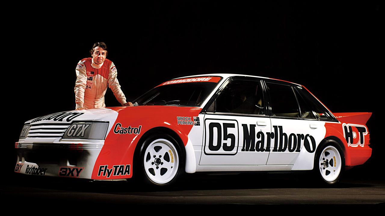 Peter Brock with his 1984 "Big Banger" VK Commodore Bathurst race car. Picture: Supplied.