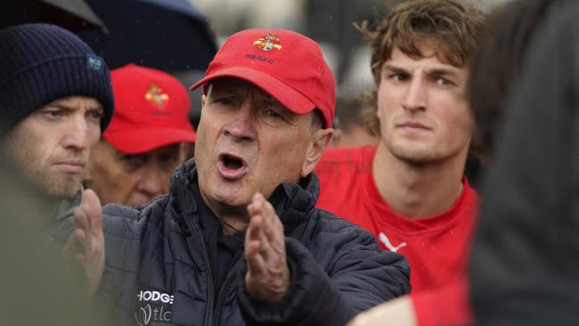 Greg Hutchison talking to his players during last season’s grand final against St Kevin’s. Picture: Valeriu Campan