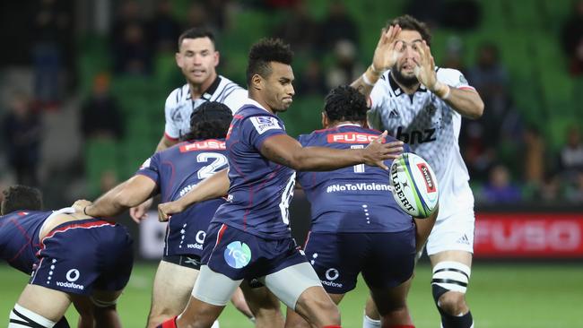 Will Genia of the Rebels kicks the ball at AAMI Park in Melbourne.