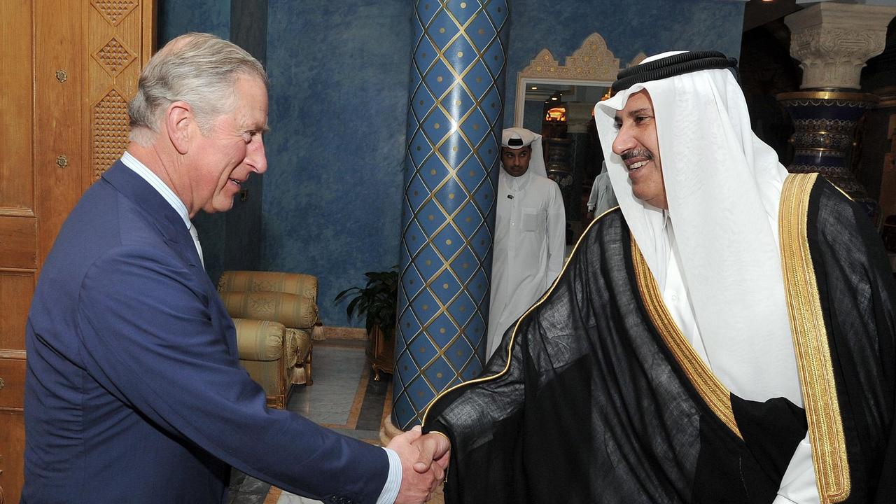 Prince Charles shakes hands with the then-Qatari Prime Minister Sheikh Hamad Bin Jassim al Thani, at his residence outside Doha in March 2013. Picture: John Stillwell/PA Wire