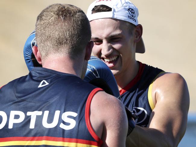 AFL - Adelaide Crows players train for the last time before the Christmas break. Tom Doedee on the boxing gloves Picture SARAH REED