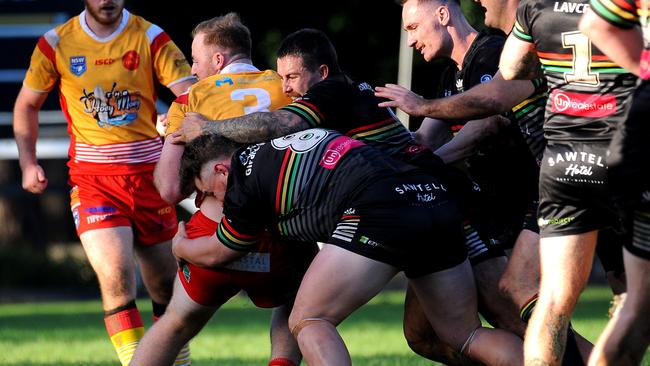 Coffs Harbour's Marty Ferguson held by the Sawtell defence. Picture: Leigh Jensen