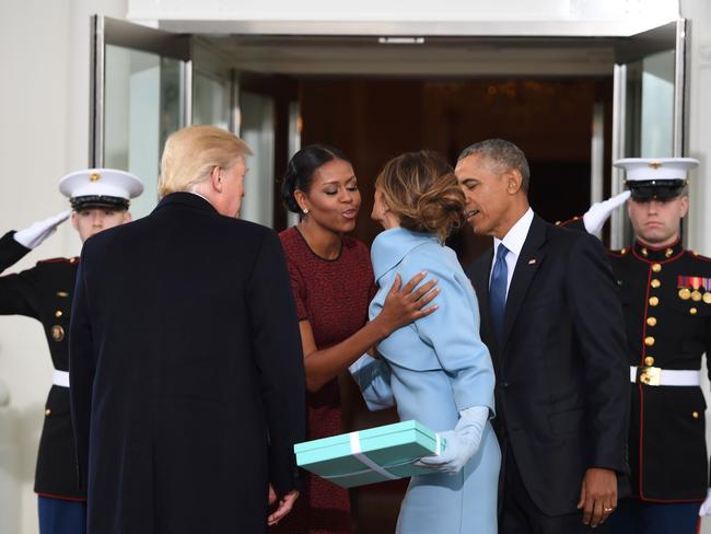 President Barack Obama and First Lady Michelle Obama welcome Preisdent-elect Donald Trump and his wife Melania to the White House in Washington, DC on January 20, 2017. Picture: AFP