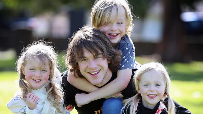 AFL player Liam Picken and his three kids Malachy, Delphine and Cheska. Picture: Alex Coppel