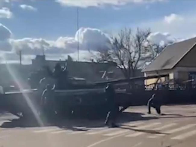 A brave Ukrainian man has been captured on video trying to block the advance of a Russian military convoy.