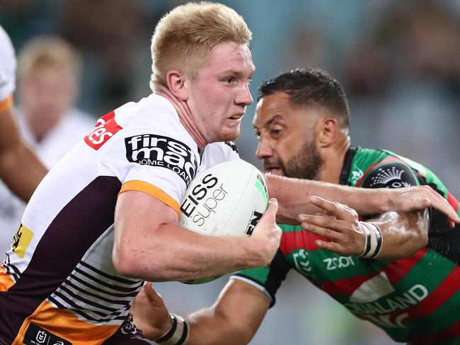 Tom Dearden of the Broncos is tackled by Benji Marshall of the Rabbitohs during the round five NRL match between the South Sydney Rabbitohs and the Brisbane Broncos at Stadium Australia. (Photo by Mark Metcalfe/Getty Images)