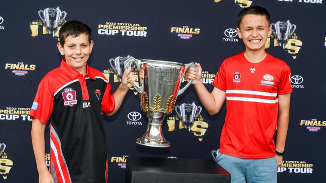 Dean Stainton and Zack Cohen stoked to get a grip of the Toyota 2022 AFL Premiership Cup during its nationwide tour.