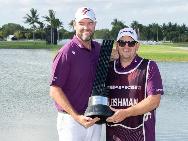 Leishman (left) celebrates his LIV Miami win with his caddie Matthew Kelly. Picture: Montana Pritchard/LIV Golf