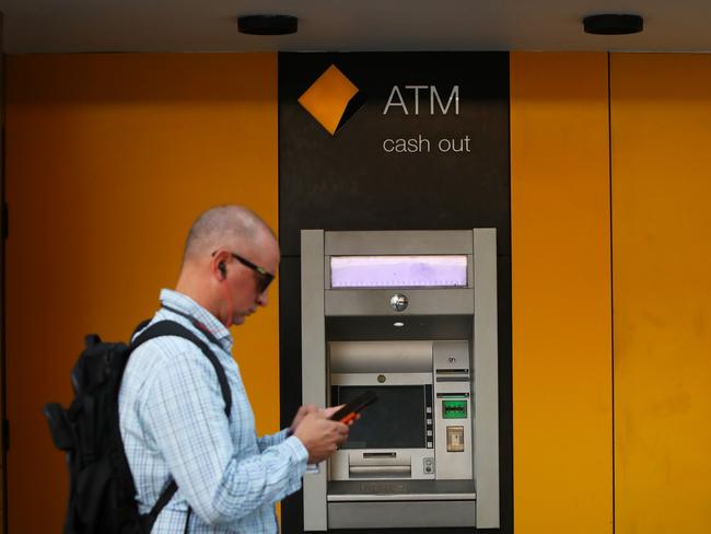 SYDNEY, AUSTRALIA - FEBRUARY 26: Pedestrians walk past a Commonwealth Bank of Australia (CBA) ATM on February 26, 2024 in Sydney, Australia. Commonwealth Bank's latest financial results reveal a robust performance, with the bank reporting a record profit of $9.6 billion for the 2022-23 fiscal year, underscoring its position as Australia's largest and most profitable lender. The strong earnings were driven by solid loan growth, improved margins, and a focus on cost control, positioning the bank for continued success in a challenging economic environment. (Photo by Lisa Maree Williams/Getty Images)