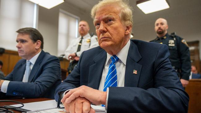 Former US President Donald Trump looks on during his criminal trial for allegedly covering up hush money payments at Manhattan Criminal Court, in New York City, on May 13, 2024. (Photo by Steven Hirsch / POOL / AFP)