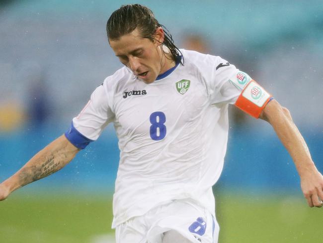 SYDNEY, AUSTRALIA - JANUARY 10: Server Djeparov of Uzbekistan controls the ball during the 2015 Asian Cup match between Uzbekistan and DPR Korea at ANZ Stadium on January 10, 2015 in Sydney, Australia. (Photo by Matt King/Getty Images)