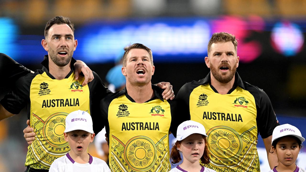 Glenn Maxwell, David Warner and Aaron Finch of Australia embrace before the match against Ireland. Photo by Bradley Kanaris/Getty Images.