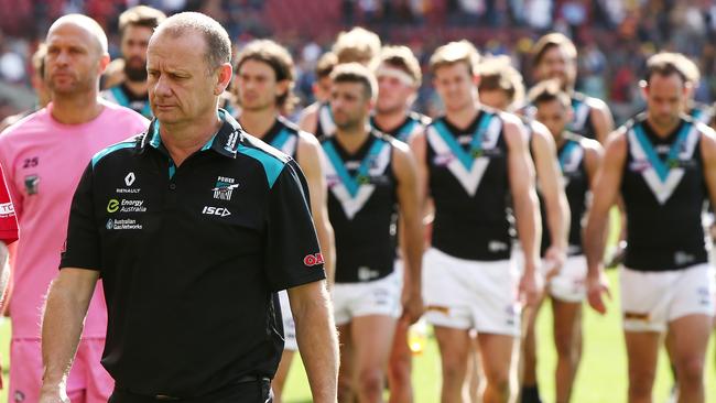 ADELAIDE, SOUTH AUSTRALIA - APRIL 02: Port Adelaide coach, Ken Hinkley and the players leave the field after the round two AFL match between the Adelaide Crows and the Port Adelaide Power at Adelaide Oval on April 2, 2016 in Adelaide, Australia. (Photo by Morne de Klerk/Getty Images)