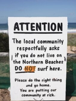 An unofficial, unauthorised homemade sign in a car park at North Narrabeen Beach. Picture: Facebook