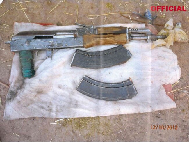 New pictures of a weapons cache, including an AK-47, found by the SAS in October 2012. Soldiers have claimed an Afghan was executed after a similar cache was discovered that month - Mr Roberts-Smith denies that claim. Picture: Federal Court of Australia