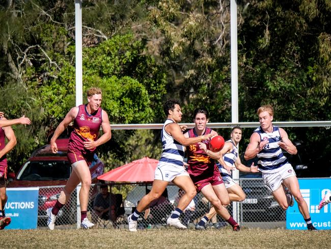 Broadbeach Cats QAFL player Michael Selsby tackling Palm Beach Currumbin player Cory Beaman. Picture credit: Brooke Sleep Photography.