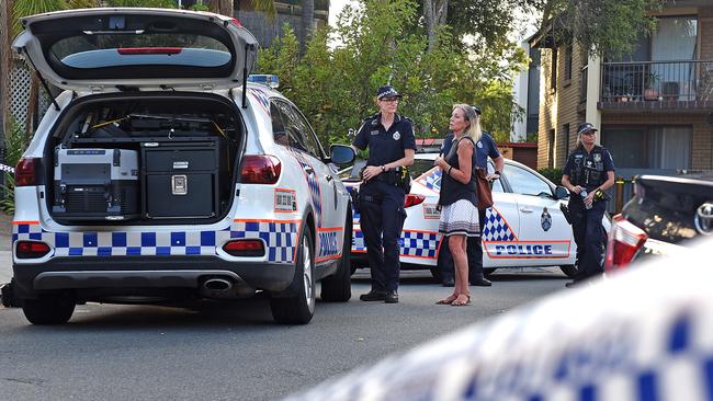 Police speak to people from the street. Picture, John Gass