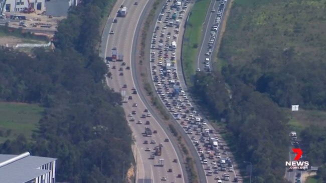 Police closed one lane of the M1, causing traffic to bank up in both directions. Picture: 7 News