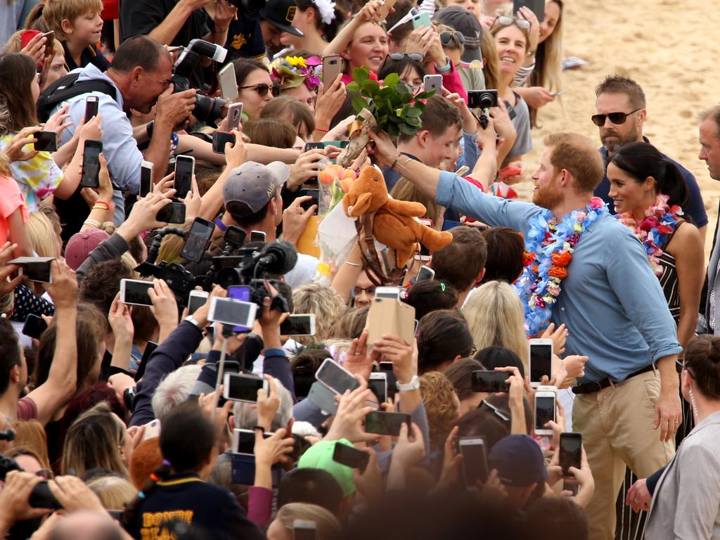 Meghan and Harry on Bondi beach meeting the locals. Picture: John Grainger