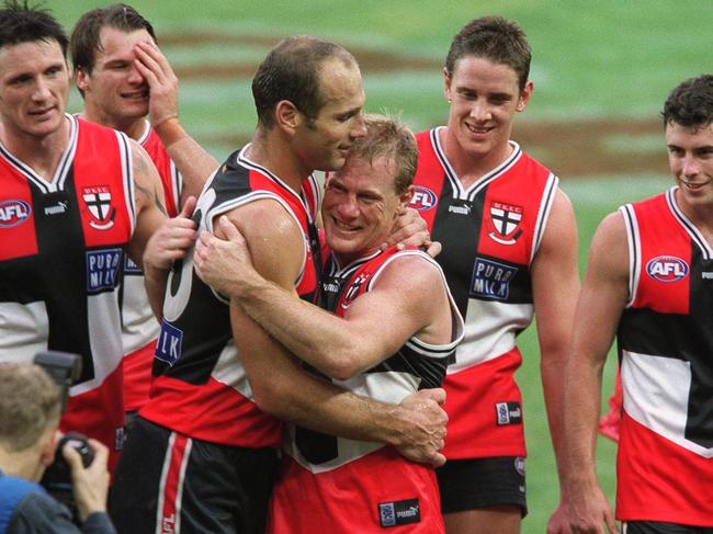 5/5/2001. Nathan Burke embraces Stewart Loewe after Loewe's 300th game. St Kilda v Sydney Swans. Colonial Stadium.