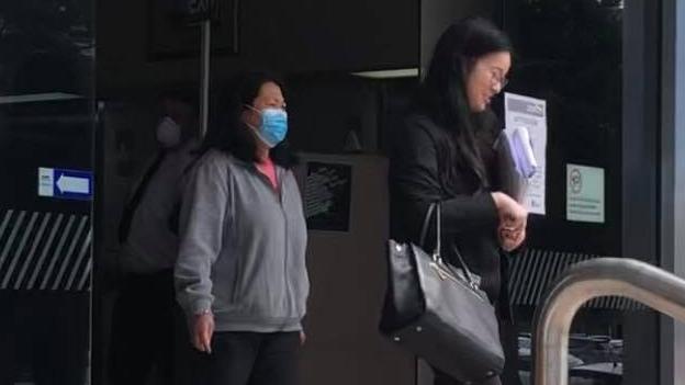 Yan Jiang, who was sentenced on Thursday for operating an illegal brothel in Mooloolaba, leaves court with her defence lawyer Jiabei Qi (right). Picture: Laura Pettigrew