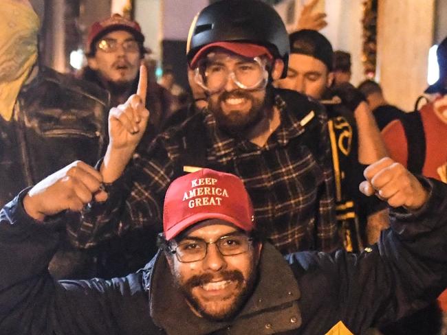 WASHINGTON, DC - DECEMBER 12: Members of the Proud Boys pose for a photo during a protest on December 12, 2020 in Washington, DC. Thousands of protesters who refuse to accept that President-elect Joe Biden won the election are rallying ahead of the electoral college vote to make Trump's 306-to-232 loss official.   Stephanie Keith/Getty Images/AFP == FOR NEWSPAPERS, INTERNET, TELCOS & TELEVISION USE ONLY ==