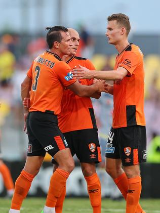 Roar players celebrate winning their game against Wellington Phoenix.