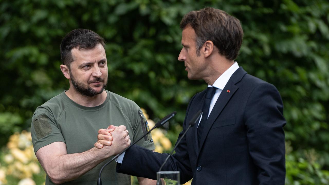 Ukrainian President Volodymyr Zelenskyy and France’s President Emmanuel Macron shake hands after a recent press conference. Picture: Alexey Furman/Getty Images